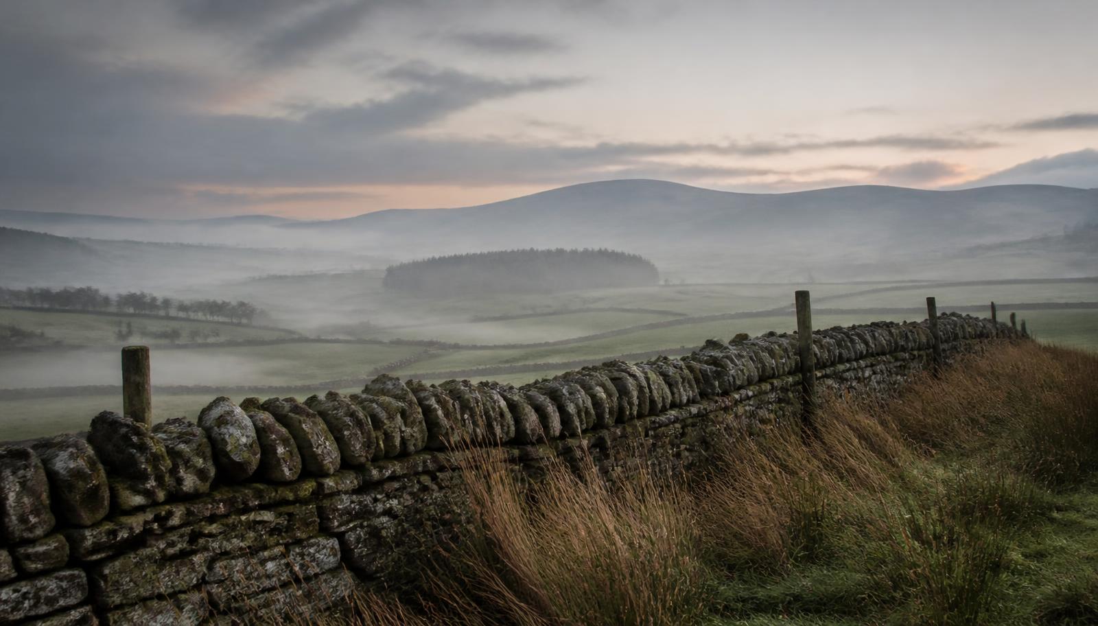Misty Lancashire landscape with a dry stone wall